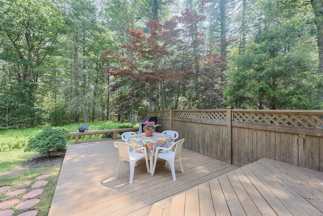 56 Burt St, Norton, MA 02766 - wooden terrace with outdoor dining space and a forest view
