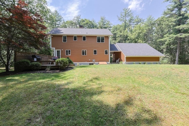 56 Burt St, Norton, MA 02766 - back of property featuring a chimney, a wooden deck, and a yard