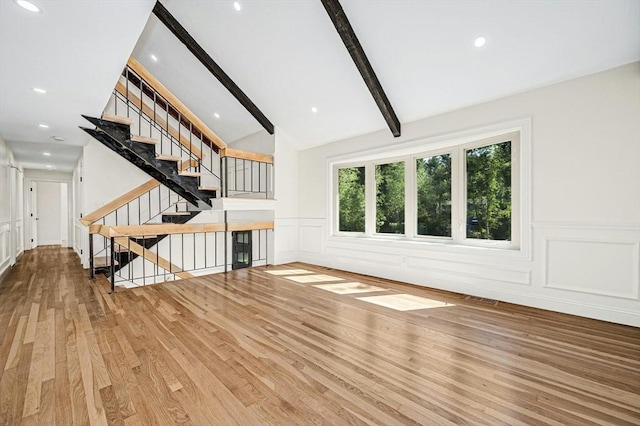 30 Twilight Dr, Foxboro, MA 02035 - unfurnished living room featuring wood finished floors, a decorative wall, stairway, a wainscoted wall, and recessed lighting