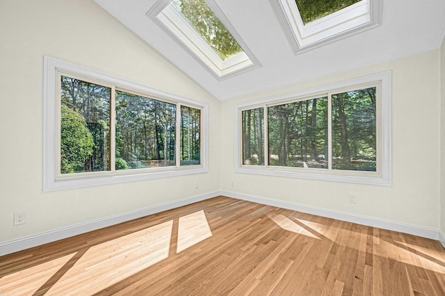 30 Twilight Dr, Foxboro, MA 02035 - unfurnished room featuring lofted ceiling, wood finished floors, and a skylight