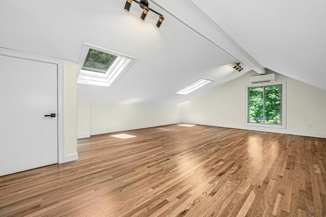 30 Twilight Dr, Foxboro, MA 02035 - bonus room with a wall unit AC, a skylight, and wood finished floors