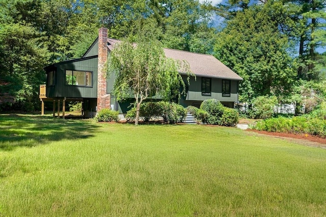 30 Twilight Dr, Foxboro, MA 02035 - bi-level home with a front yard and a chimney