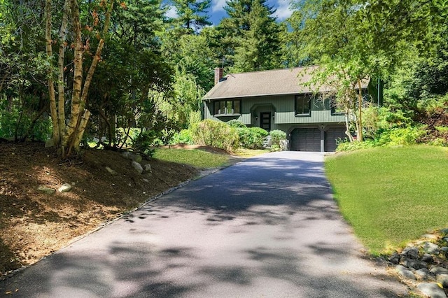 30 Twilight Dr, Foxboro, MA 02035 - bi-level home featuring asphalt driveway, an attached garage, a chimney, and a front yard