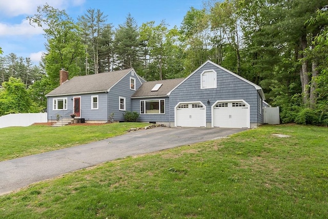 12 Billings St, Acton, MA 01720 - view of front of house featuring asphalt driveway, a chimney, a front lawn, roof with shingles, and view of wooded area