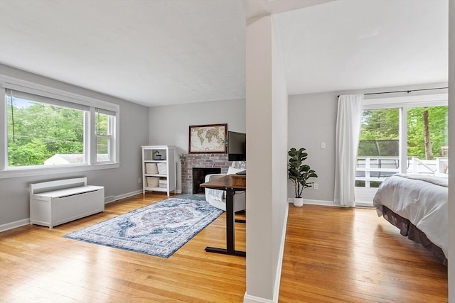 12 Billings St, Acton, MA 01720 - bedroom featuring access to outside, hardwood / wood-style flooring, baseboards, and a fireplace