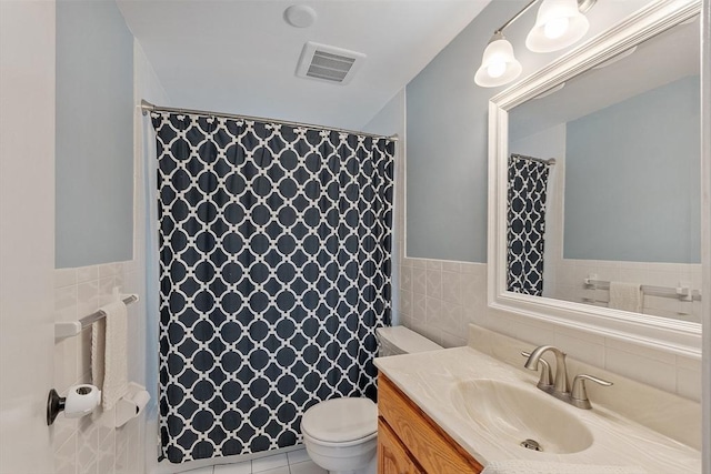 12 Billings St, Acton, MA 01720 - full bath featuring tile walls, toilet, vanity, curtained shower, and wainscoting