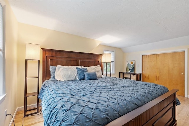 12 Billings St, Acton, MA 01720 - bedroom featuring light wood-type flooring, lofted ceiling, and baseboards