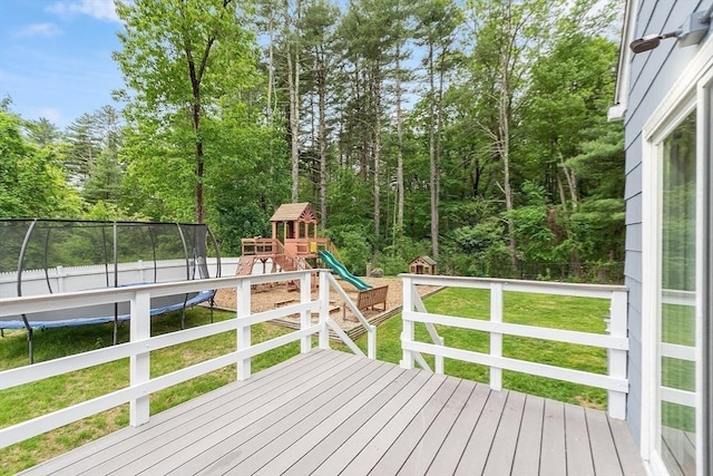 12 Billings St, Acton, MA 01720 - wooden deck featuring a trampoline and a playground