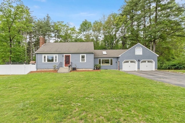 12 Billings St, Acton, MA 01720 - view of front of home with asphalt driveway, an attached garage, a chimney, and a shingled roof
