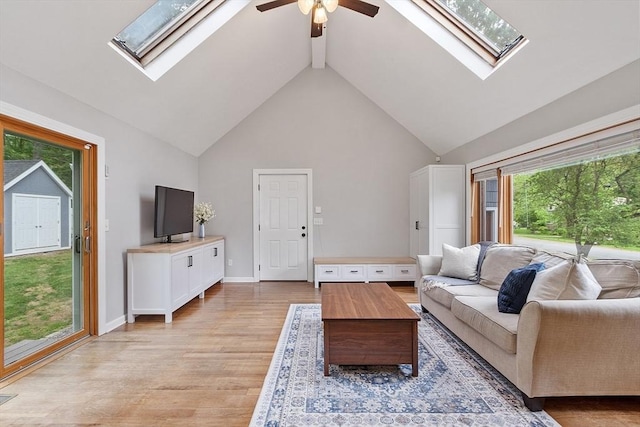 12 Billings St, Acton, MA 01720 - living room with a skylight, healthy amount of natural light, a ceiling fan, light wood-type flooring, and high vaulted ceiling