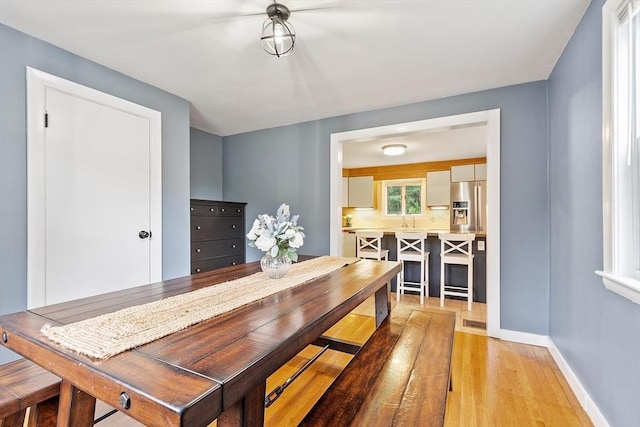 12 Billings St, Acton, MA 01720 - dining area featuring light wood-style floors and baseboards