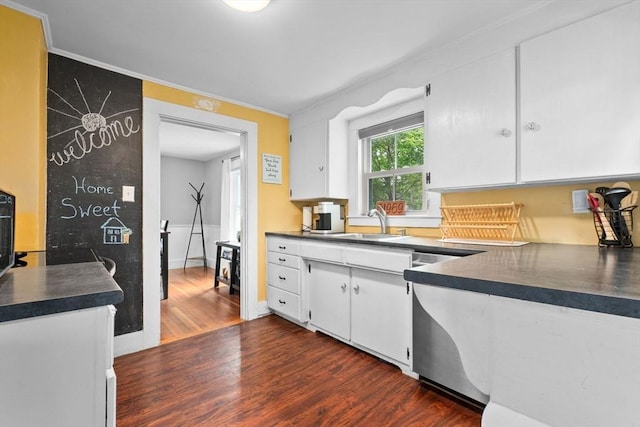 50 Wethersfield, Rowley, MA 01969 - kitchen with dishwasher, dark countertops, dark wood-style floors, white cabinets, and ornamental molding