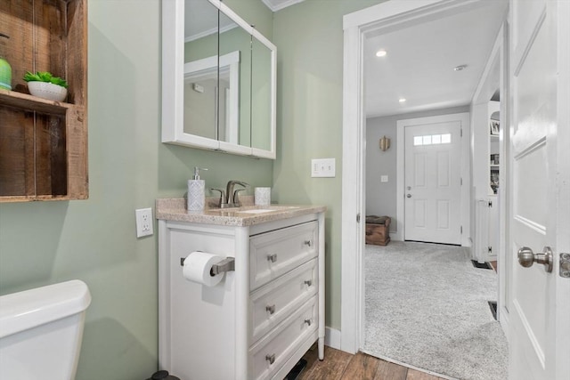 50 Wethersfield, Rowley, MA 01969 - bathroom with vanity, toilet, recessed lighting, crown molding, and wood finished floors