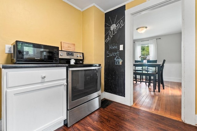 50 Wethersfield, Rowley, MA 01969 - kitchen featuring stainless steel electric range oven, black microwave, dark wood-style flooring, crown molding, and baseboards
