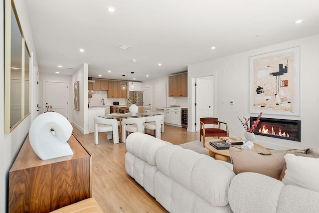 20 Audubon Way Unit 203, Canton, MA 02021 - living area with recessed lighting, a glass covered fireplace, and light wood-style floors
