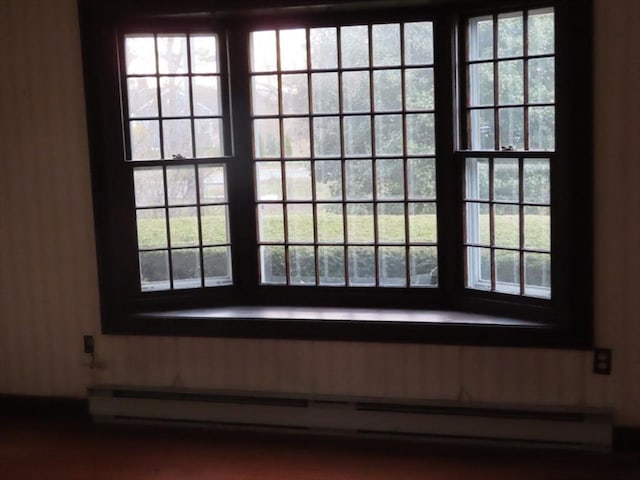 room details with a baseboard heating unit