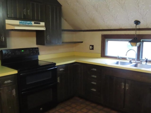 kitchen featuring double oven range, under cabinet range hood, light countertops, vaulted ceiling, and a sink