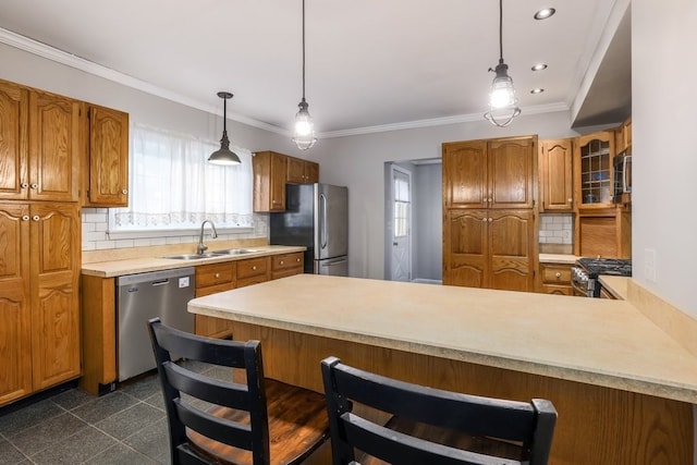 kitchen with backsplash, kitchen peninsula, pendant lighting, stainless steel appliances, and sink