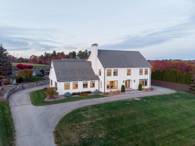 61 Chickering Rd, Spencer, MA 01562 - view of front of home with a chimney, a front lawn, and curved driveway
