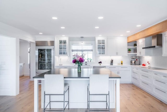61 Chickering Rd, Spencer, MA 01562 - kitchen featuring wall chimney exhaust hood, stainless steel appliances, a kitchen breakfast bar, open shelves, and recessed lighting