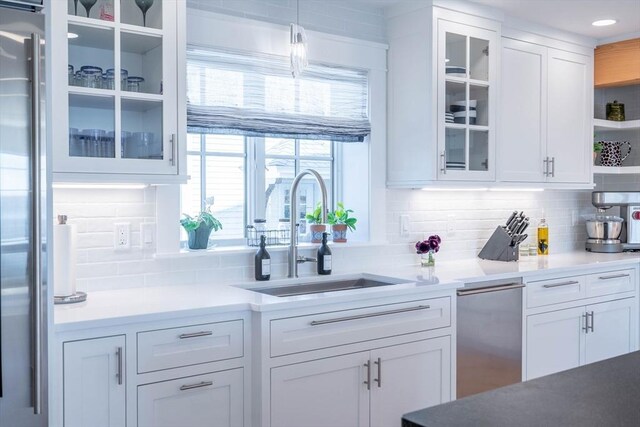 61 Chickering Rd, Spencer, MA 01562 - kitchen featuring open shelves, a sink, white cabinetry, and decorative backsplash