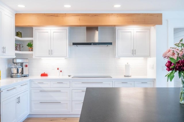 61 Chickering Rd, Spencer, MA 01562 - kitchen with wall chimney range hood, black electric stovetop, open shelves, white cabinets, and backsplash