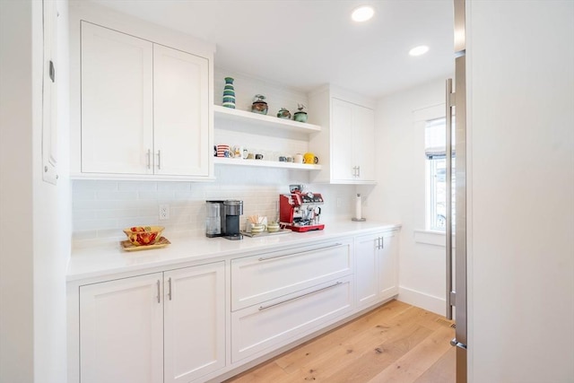 61 Chickering Rd, Spencer, MA 01562 - kitchen featuring light wood-type flooring, backsplash, white cabinetry, and recessed lighting