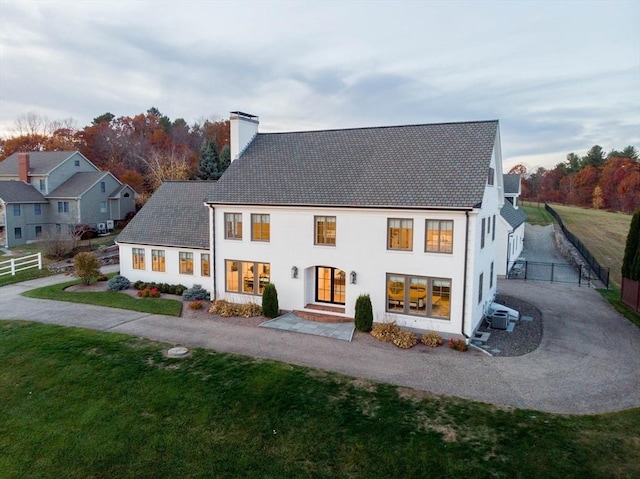 61 Chickering Rd, Spencer, MA 01562 - back of property featuring a chimney, driveway, and cooling unit