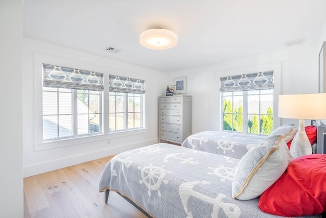 61 Chickering Rd, Spencer, MA 01562 - bedroom with multiple windows, baseboards, and wood finished floors
