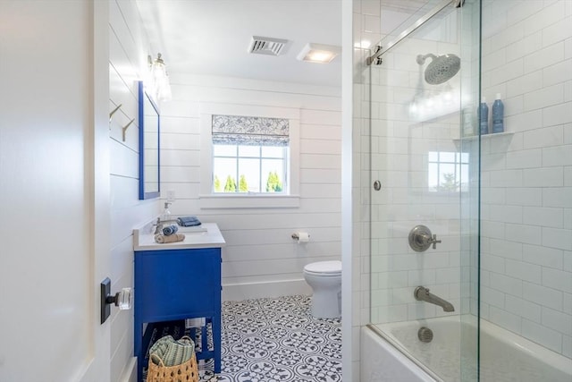 61 Chickering Rd, Spencer, MA 01562 - bathroom with toilet, vanity, bath / shower combo with glass door, and tile patterned flooring