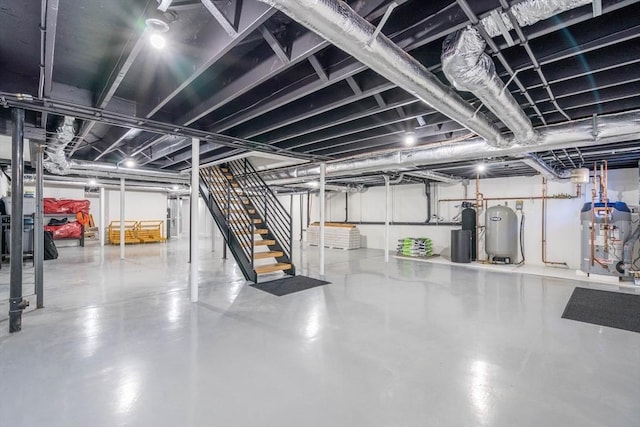 61 Chickering Rd, Spencer, MA 01562 - basement with water heater, a water softener system, and stairs