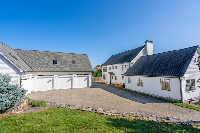 61 Chickering Rd, Spencer, MA 01562 - rear view of property with a chimney and a garage