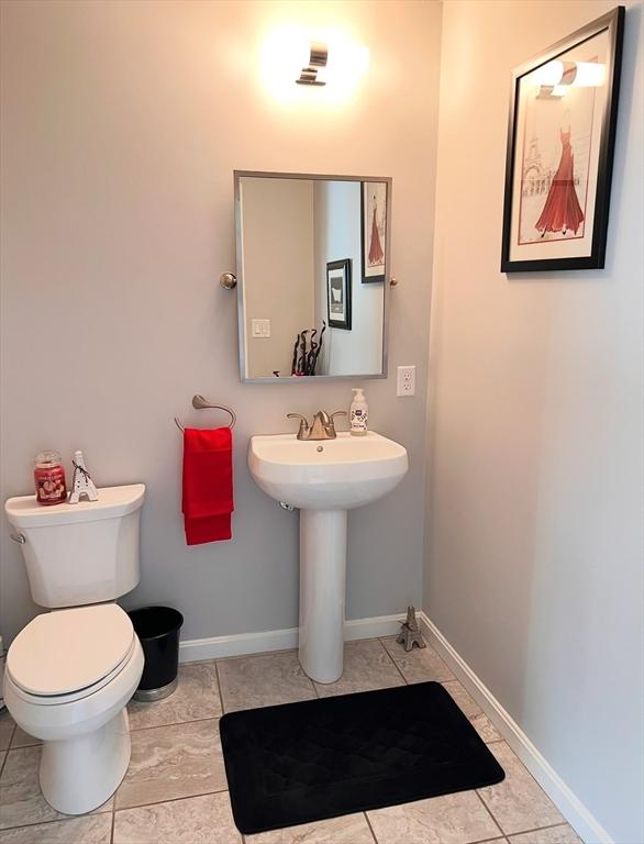 bathroom with tile patterned floors and toilet