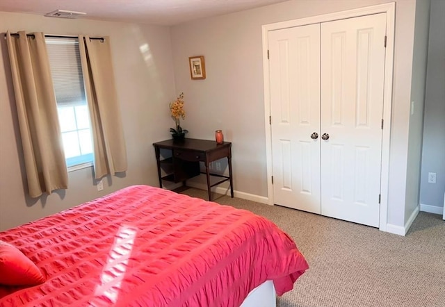 carpeted bedroom with a closet