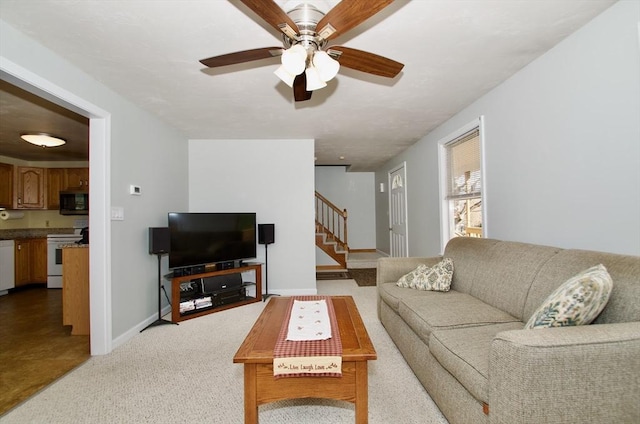 living room featuring ceiling fan and light colored carpet