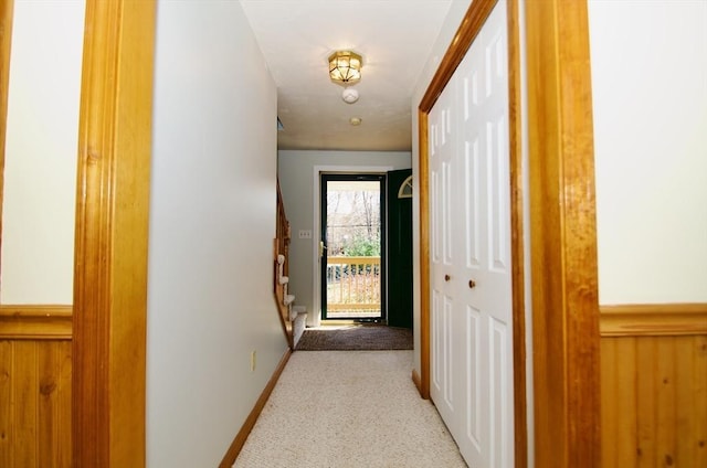 corridor with light colored carpet