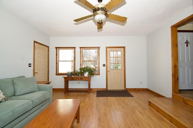 unfurnished living room with ceiling fan and light hardwood / wood-style floors