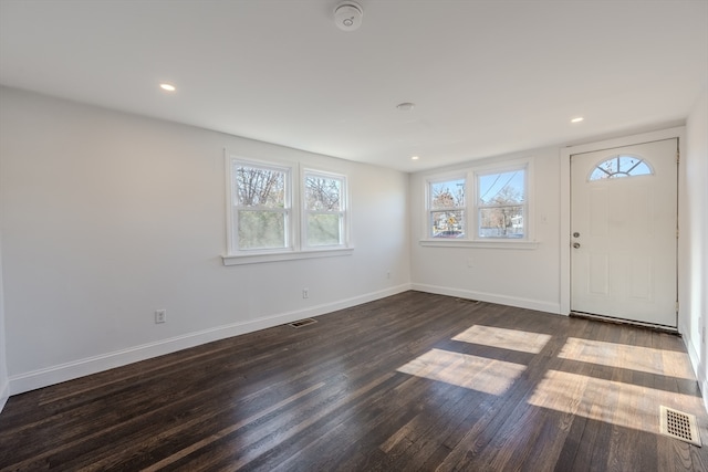 foyer entrance featuring dark hardwood / wood-style floors