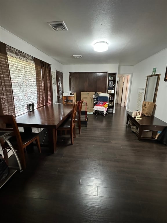 dining room featuring dark wood-type flooring