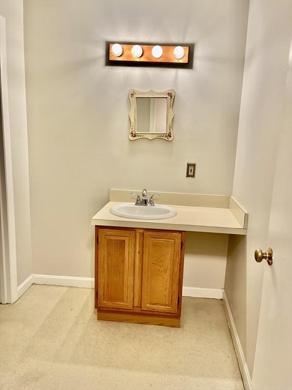 38 Dunham Rd Unit 303, Beverly, MA 01915 - bathroom with vanity and baseboards