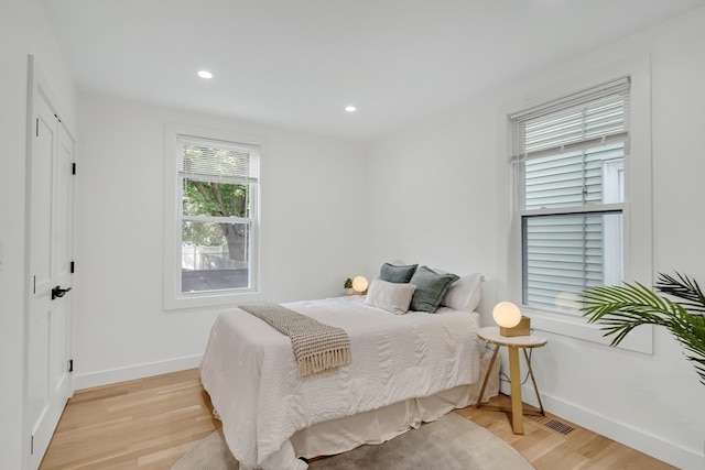 bedroom with light hardwood / wood-style flooring