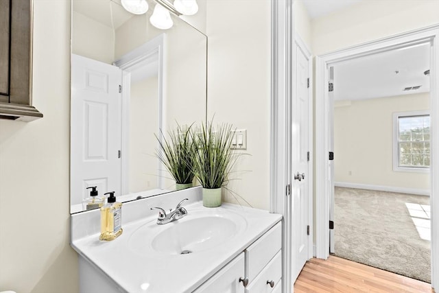 bathroom with vanity and wood-type flooring