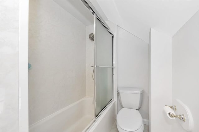 bathroom with bath / shower combo with glass door and toilet