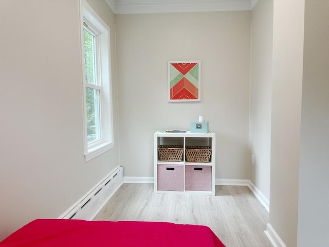 31 Horton St, Attleboro, MA 02703 - detailed view of a baseboard heating unit, wood finished floors, ornamental molding, and baseboards