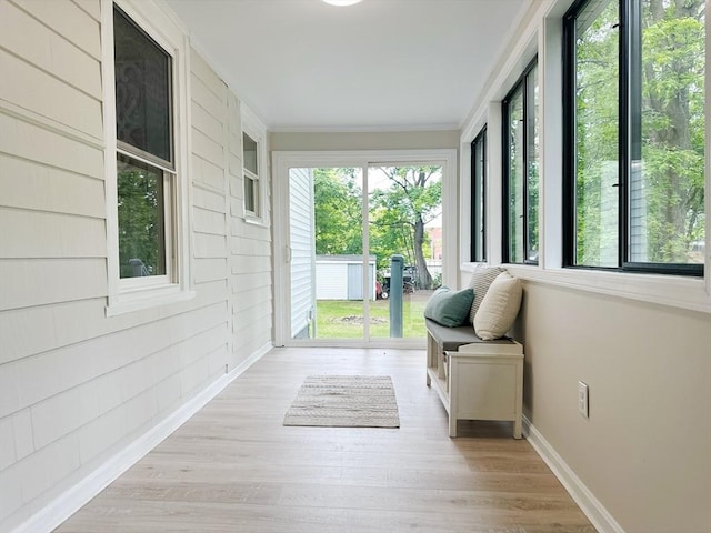 31 Horton St, Attleboro, MA 02703 - sunroom featuring ornamental molding, baseboards, and wood finished floors