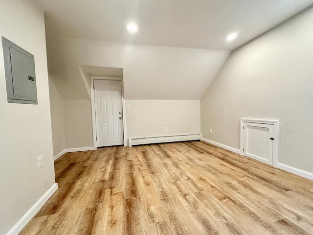 31 Horton St, Attleboro, MA 02703 - bonus room with electric panel, a baseboard radiator, wood finished floors, baseboards, and vaulted ceiling