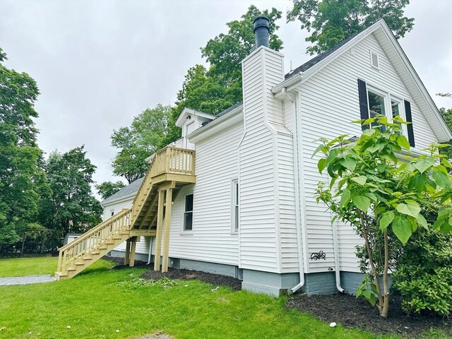 31 Horton St, Attleboro, MA 02703 - view of side of home featuring stairway, a yard, a chimney, and a deck
