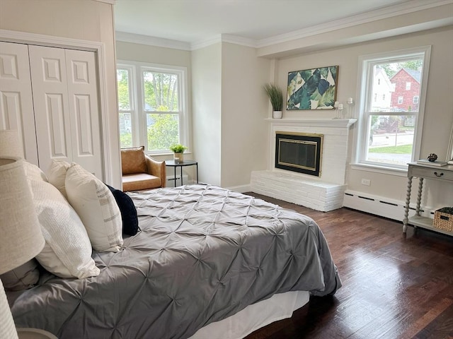 31 Horton St, Attleboro, MA 02703 - bedroom with ornamental molding, a brick fireplace, wood finished floors, baseboards, and a closet