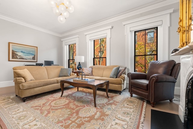 sitting room with light hardwood / wood-style flooring, an inviting chandelier, and crown molding