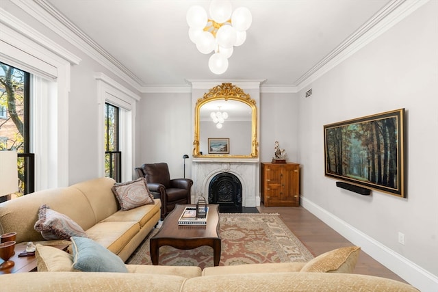 living room with hardwood / wood-style flooring, a wealth of natural light, and a chandelier